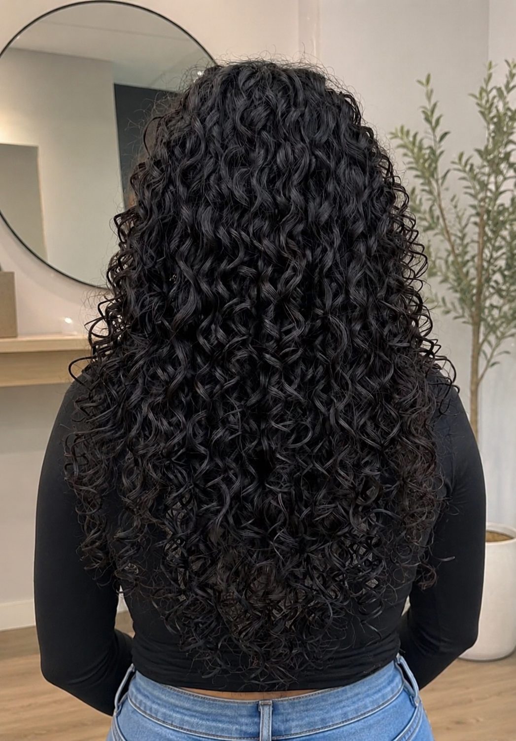 Long jet black spiral perm, full volume