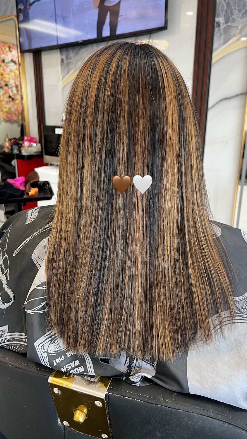 Golden blonde balayage with soft glossy curls