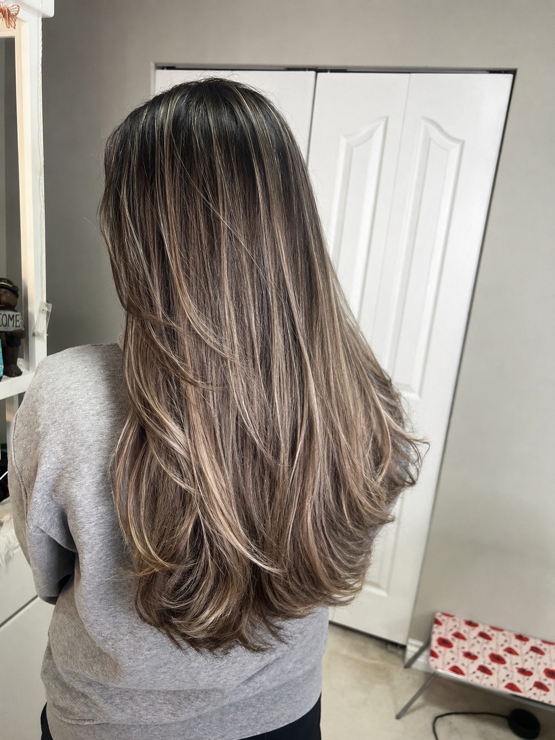 Cool ash bronde balayage, glass-straight finish